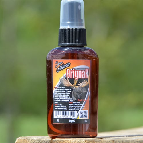 Ferme Monette plus Orignak 60ml bottle featuring a rustic design, showcasing natural ingredients and a blend of flavors, ideal for enhancing culinary dishes.