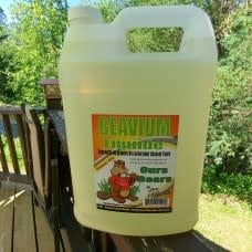 4-liter bottle of BEAVIUM LIQUIDE next to Ferme Monette products, showcasing premium quality ingredients for culinary use.