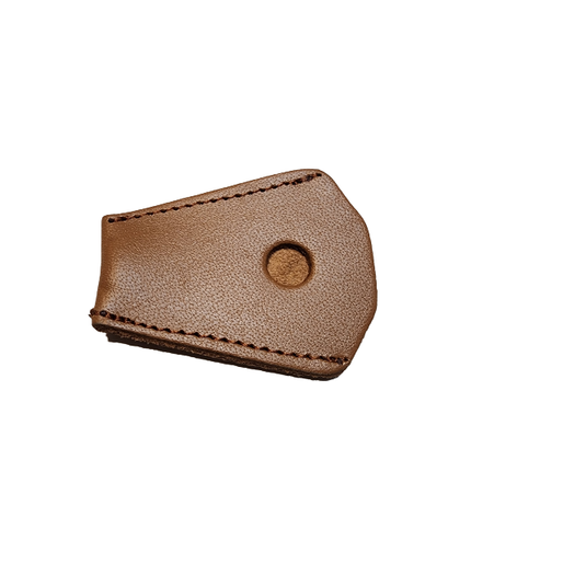 Close-up of a pair of elegant leather pointe shoes, featuring a rich, textured surface of Legacy Leather, complemented by a protective pointe cover that enhances durability and style.