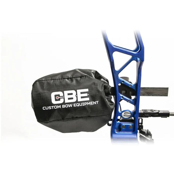 Close-up of a CBE sight scope cover, showcasing its durable design and protective features, with a blurred outdoor background.