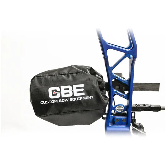 Close-up of a CBE sight scope cover, showcasing its durable design and protective features, with a blurred outdoor background.