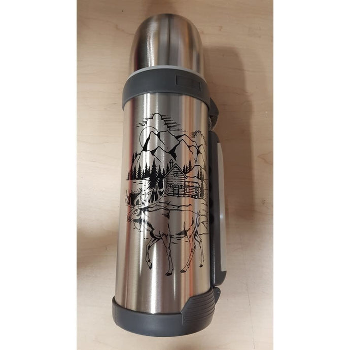 An elegant display of the Entrepot du Chasseur wine bottle alongside a sleek Thermos, set against a rustic wooden table, highlighting the perfect pairing for outdoor adventures.