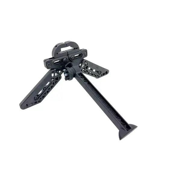 Pine Ridge Archery Kwik Stand Tripod set up in a natural outdoor setting, showcasing its sturdy design and adjustable features, with an archery target in the background.
