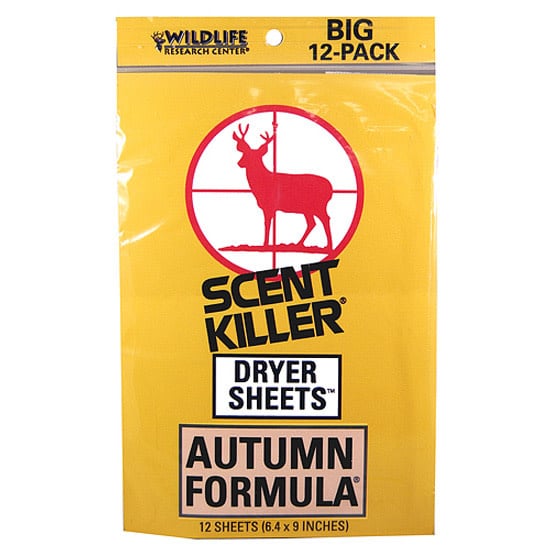 Wildlife Research Center scent killer autumn formula dryer sheets displayed on a wooden surface, surrounded by autumn leaves, evoking a fresh and natural scent.